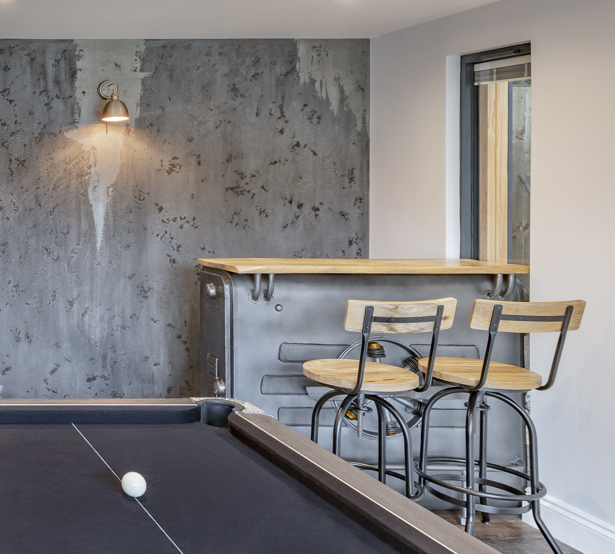 mancave bar with pool table and venetian plaster feature wall horsham