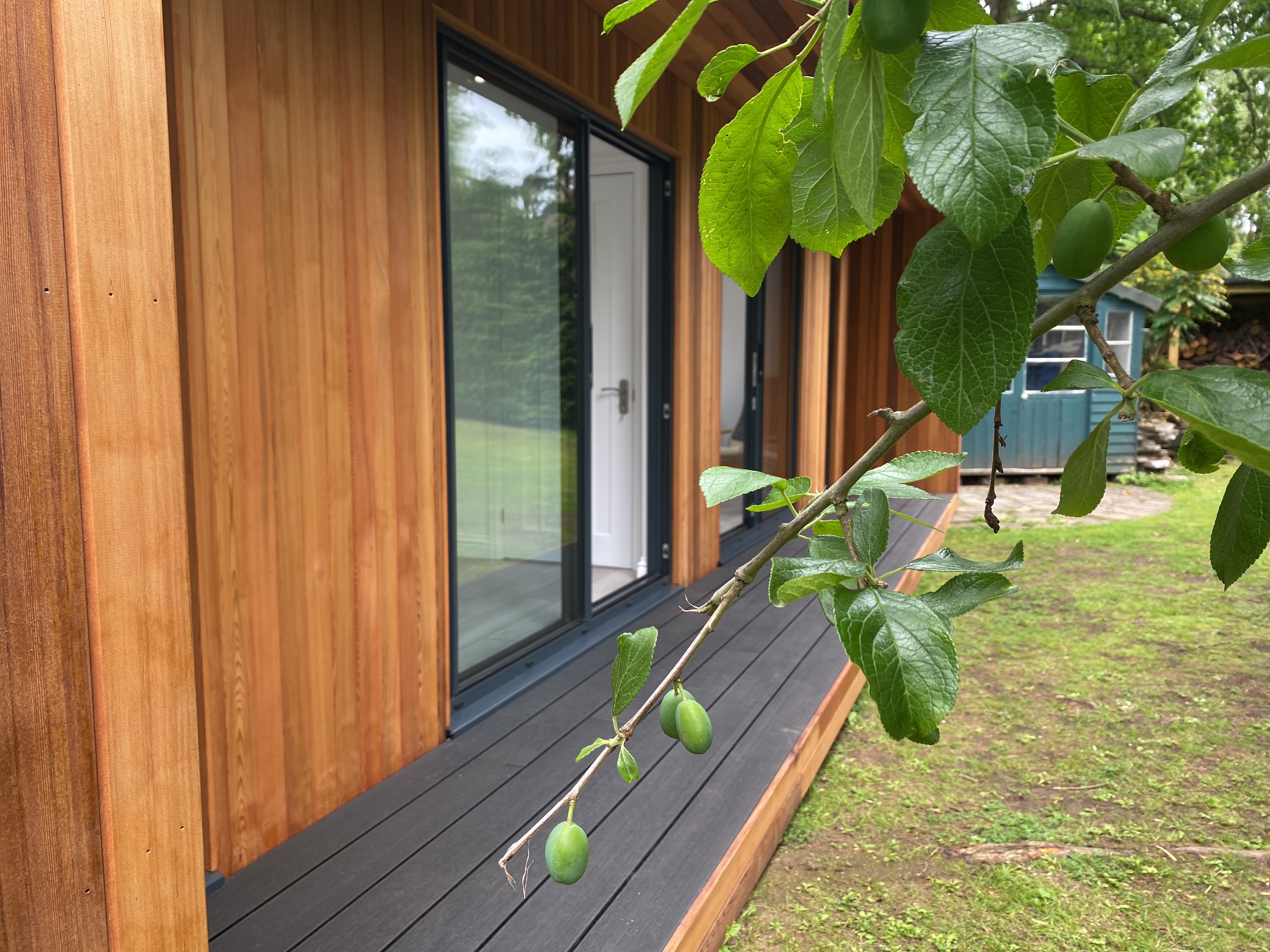 composite decking and western red cedar cladding on garden room in tadworth surrey