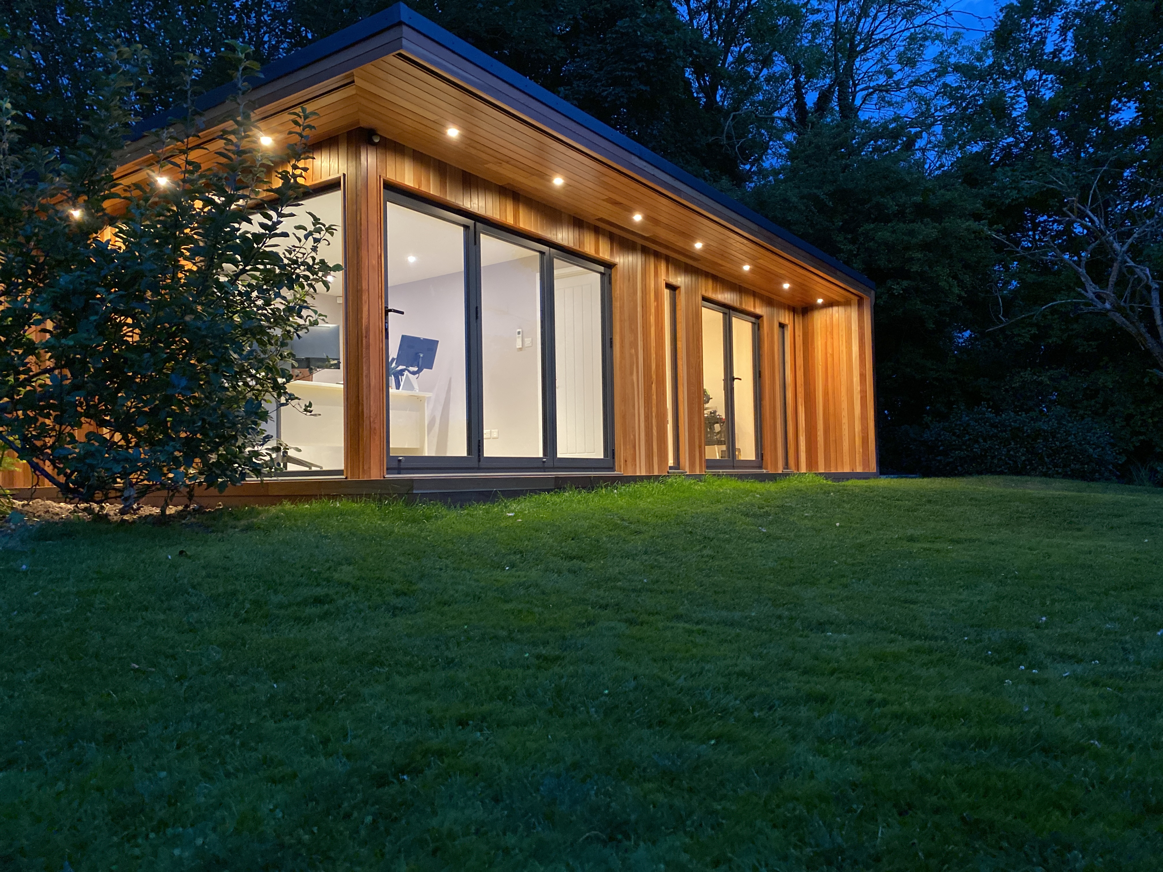 garden studio in tadworth with dual aspect glass corner and bifolds